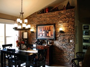 Making use of lighting elements and a faux stone accent wall, this customer's design plan served to enhance his dining room and highlight their wine collection.