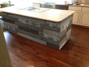 Faux barnboard paneling designed to look like real reclaimed wood, wrapped around a kitchen island