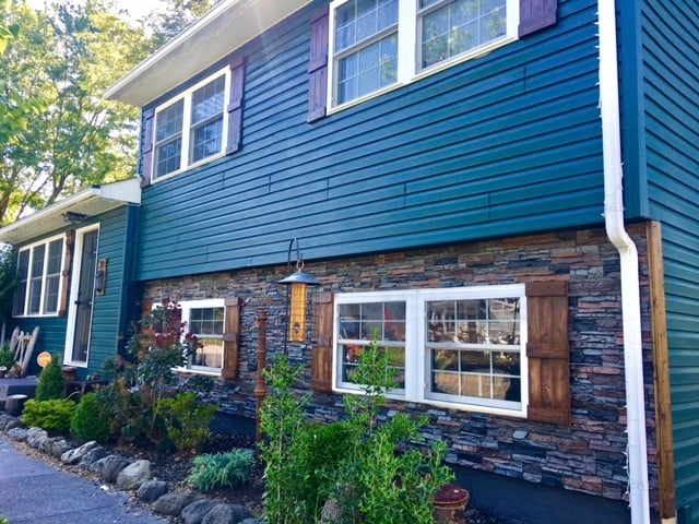 Home exterior sided with Norwich panels