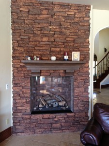 Fireplace remodel using realistic, lightweight faux stone veneer panels.