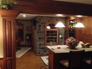 The artificial cobblestone panels complements the exisitng wood fixtures beautifully.