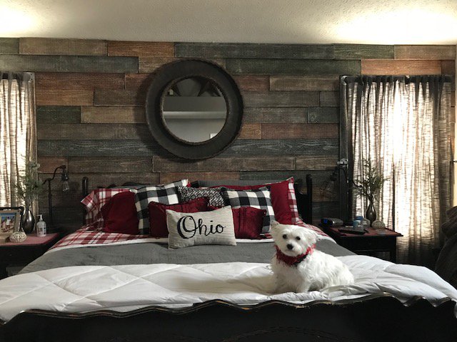 DIY wood accent wall in a bedroom created with Faux Reclaimed panels.