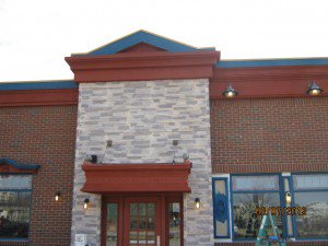 Max and Erma's Restaurant new storefront, with lightweight veneer mimicking real stacked stone added to the entrance.