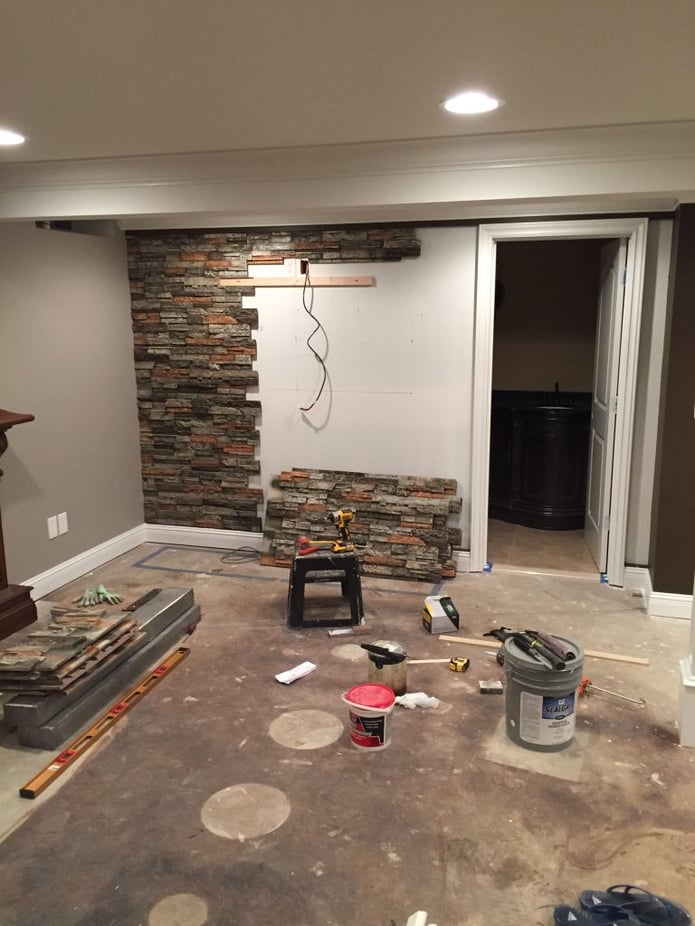 Basement wall being covered with Wellington Drystack panels