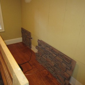 Using interlocking faux stone panels makes for a realistic and seamless appearance.