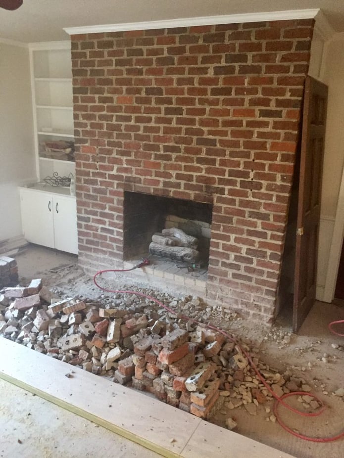 The original fireplace was made from 1970s era red brick, and looked a little dated.