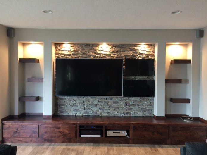 Rustic man cave's new media center finished with Regency Stacked Stone panels in Misty Morning color.