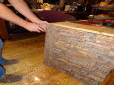 Secure the trim piece in place with construction glue and screws.