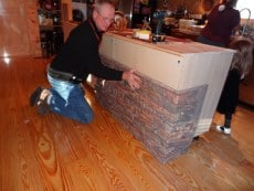 Interlock the panel on your kitchen island with the previously installed corner piece.