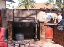 Kitchen design outdoors using faux stone panels