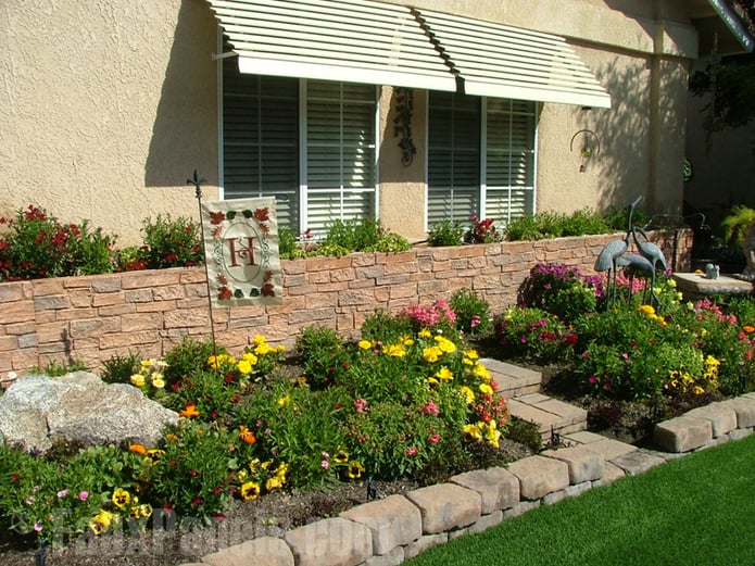 Man made stone panels enhance the beauty of garden walls.