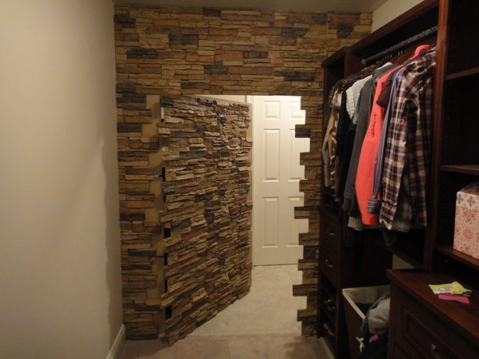Hidden door made for a walk-in closet using Norwich Stacked Stone panels.