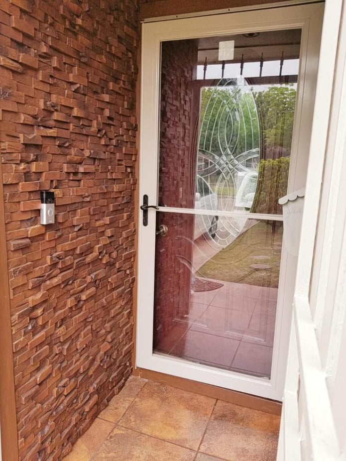 New entryway design with Wood Plank panels replacing the original wood siding