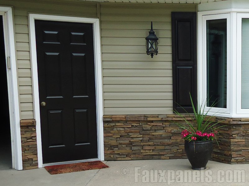 Home front entrance with stacked stone wainscoting